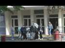 Arras attack: Gambetta secondary school pupils collect flowers before classes resume
