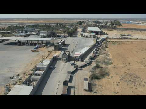 AERIALS: Lorries line up in Palestinian Rafah to collect aid delivered from Egypt