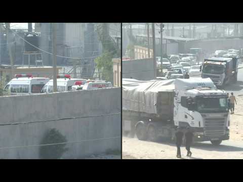 Trucks loaded with humanitarian aid enter Rafah and ambulances wait
