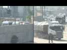 Trucks loaded with humanitarian aid enter Rafah and ambulances wait