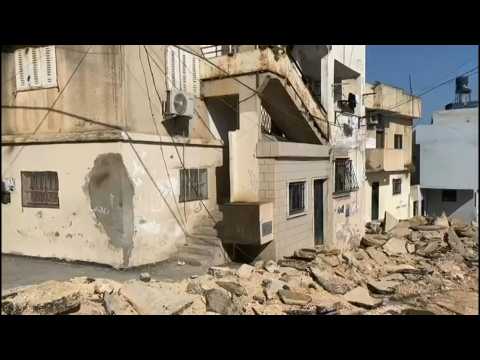 Damaged houses and cars in West Bank after deadly Israeli raid