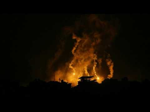 Flares light up sky at night in Gaza City