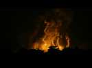 Flares light up sky at night in Gaza City