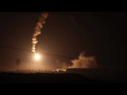 Flares and strikes over northern Gaza seen from Israel
