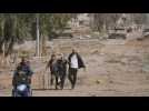 Heavy Israeli deployment as Gazans flee south on first day of truce