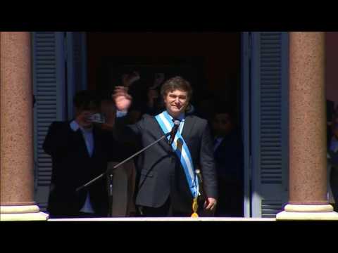 Argentina's president Milei greets supporters from balcony