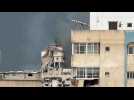 Smoke rises from destroyed building after strikes in Gaza City