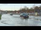 Cars crawl along water-logged roads in flood-hit northern France