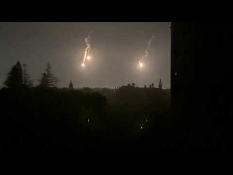 Flares light up sky at night in Gaza City