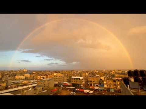 Rainbow appears in sky above Rafah at sunrise