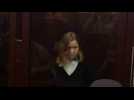 Russian cafe bomb suspect appears in court as trial opens