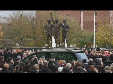 Bobby Charlton's funeral cortege passes by Old Trafford