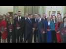 New Polish government poses for photo after Tusk sworn in as Prime Minister