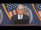 US Fed holds key lending rate, signals three cuts in 2024