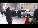 French FM arriving to Kyiv and laying flowers to the memory wall