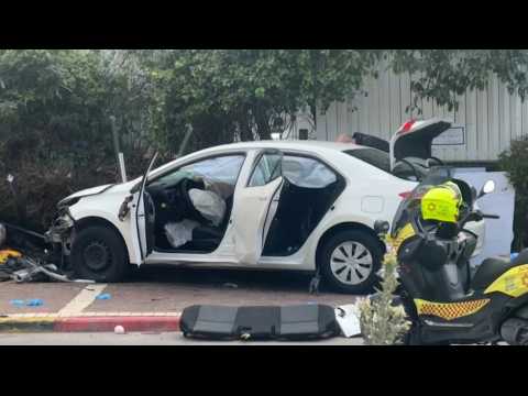 Israeli forces inspect damaged car following suspected attack in central Israel