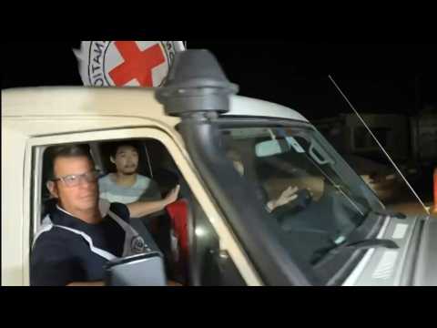 Released hostages cross the Palestinian side of the Rafah crossing with Egypt