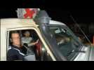 Released hostages cross the Palestinian side of the Rafah crossing with Egypt