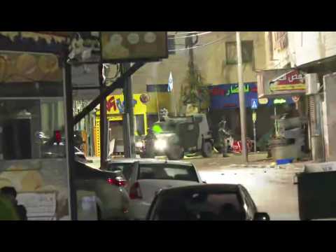 Palestinians carry injured, as clashes erupt ahead of prisoners release