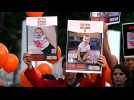 Relatives of infant hostage call for his release during protest in Tel Aviv