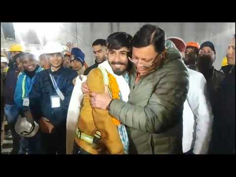 Indian official greets workers after rescue from tunnel