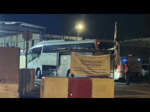 A bus arrives at Ofer prison to collect Palestinian prisoners ahead of expected release