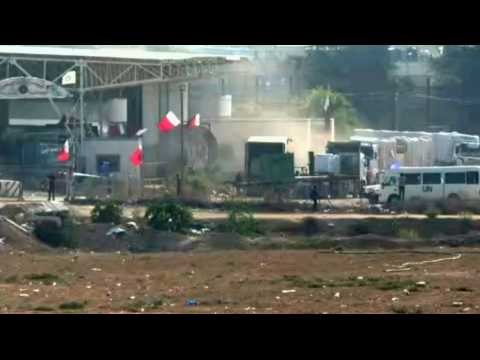 Trucks are loaded with aid on Palestinian side of the Rafah crossing