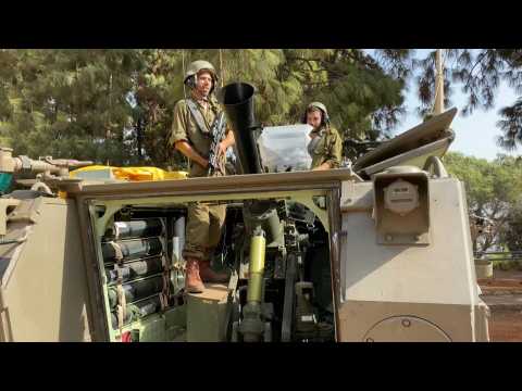 Israeli soldiers man a military position near Lebanon border