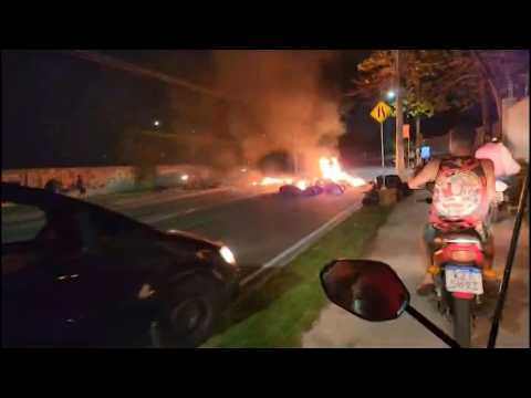 Fires in streets of Rio de Janeiro as militia members torch 35 buses