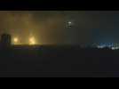 Flares descend on Gaza as Israeli warplanes pound the Palestinian territory