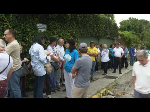 Venezuelans wait for polls opening in opposition primary election