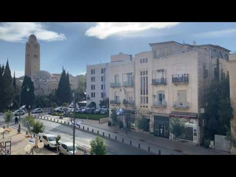 Poeple run for cover as air-raid sirens sound in Jerusalem