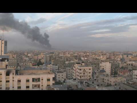 Smoke billows over Gaza City as 23rd day of war ends
