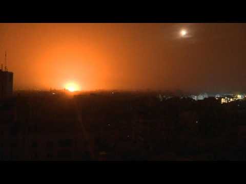 Gaza City night sky filled with explosions and flares