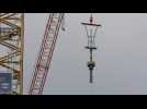 Cross for new spire installed on Paris' Notre-Dame cathedral