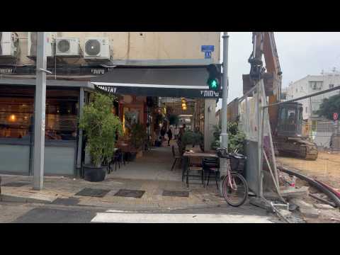 People run for cover in Tel Aviv as warning sirens go off