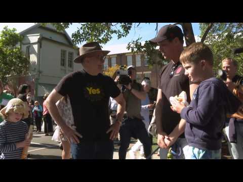 Australian PM arrives at polling station as people cast their votes