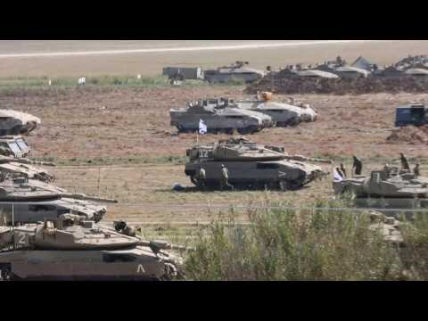 Israeli soldiers take cover as sirens sound near Gaza border