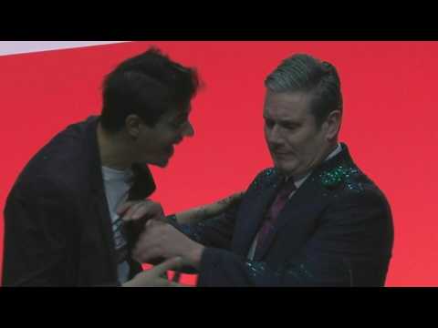 Protester disrupts start of UK opposition leader's conference speech