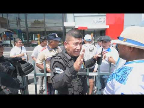 Riot police disperse protesters outside McDonald's in Guatemala City