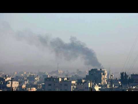Smoke billows following Israeli strikes on Khan Yunis, seen from Rafah