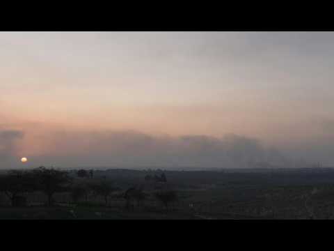 TIMELAPSE: Smoke billows, sun sets for last time of the year over central Gaza