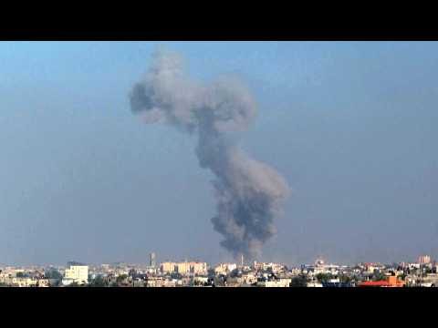 Smoke billows following Israeli strikes on Khan Yunis, seen from Rafah