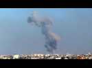 Smoke billows following Israeli strikes on Khan Yunis, seen from Rafah
