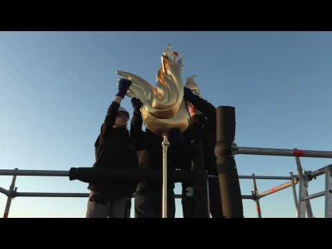 Golden rooster fitted to spire of Paris's Notre Dame cathedral