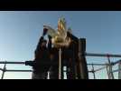 Golden rooster fitted to spire of Paris's Notre Dame cathedral