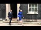 Theresa May leaves Downing St to meet Queen