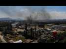 Firemen work to put out fire at Rio oil refinery