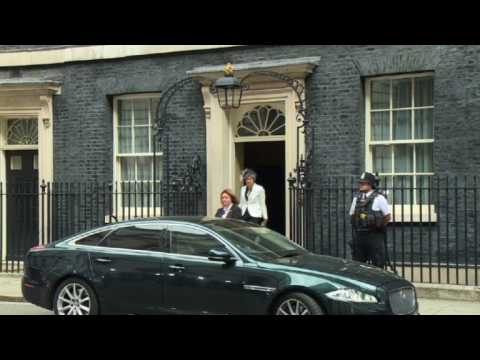 Theresa May leaves cabinet meeting day after top ministers quit