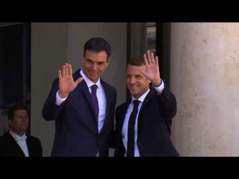 New Spanish PM Pedro Sanchez meets with France's Macron in Paris